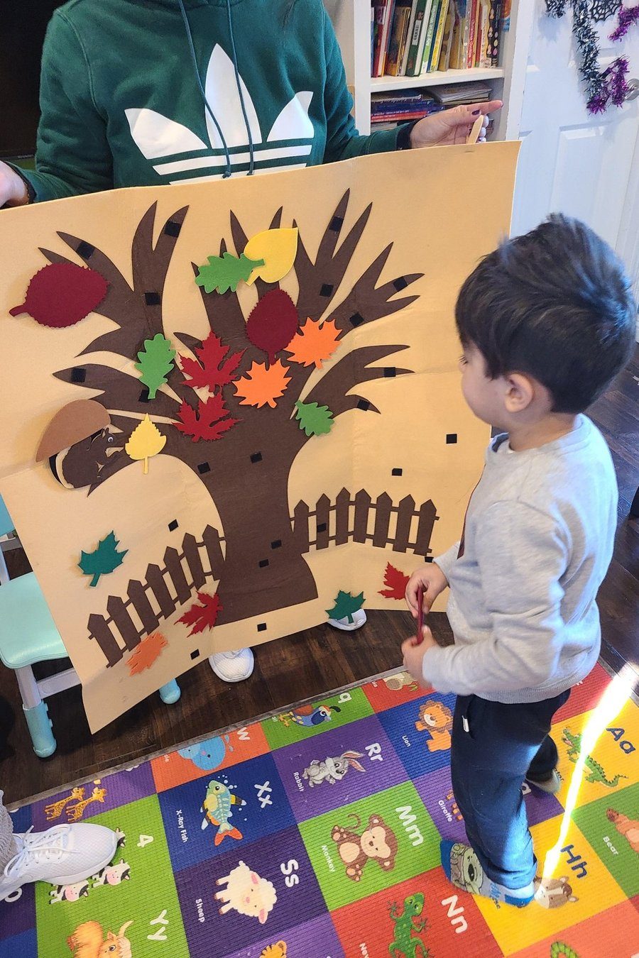 Child participating in a seasonal art project during creative play at Shila’s Daycare.